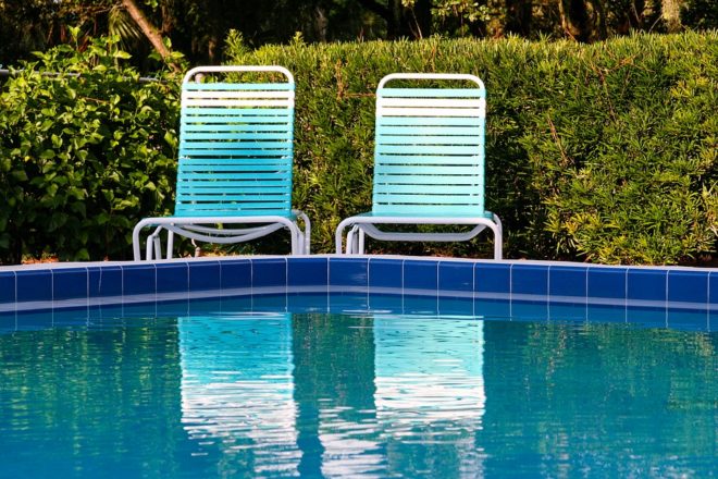 chairs side by pool